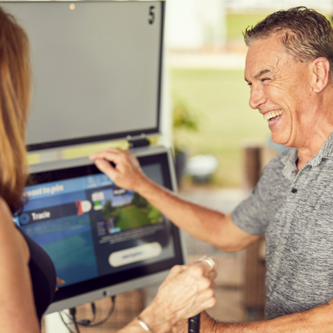 Photo of a man using the toptracer monitor software